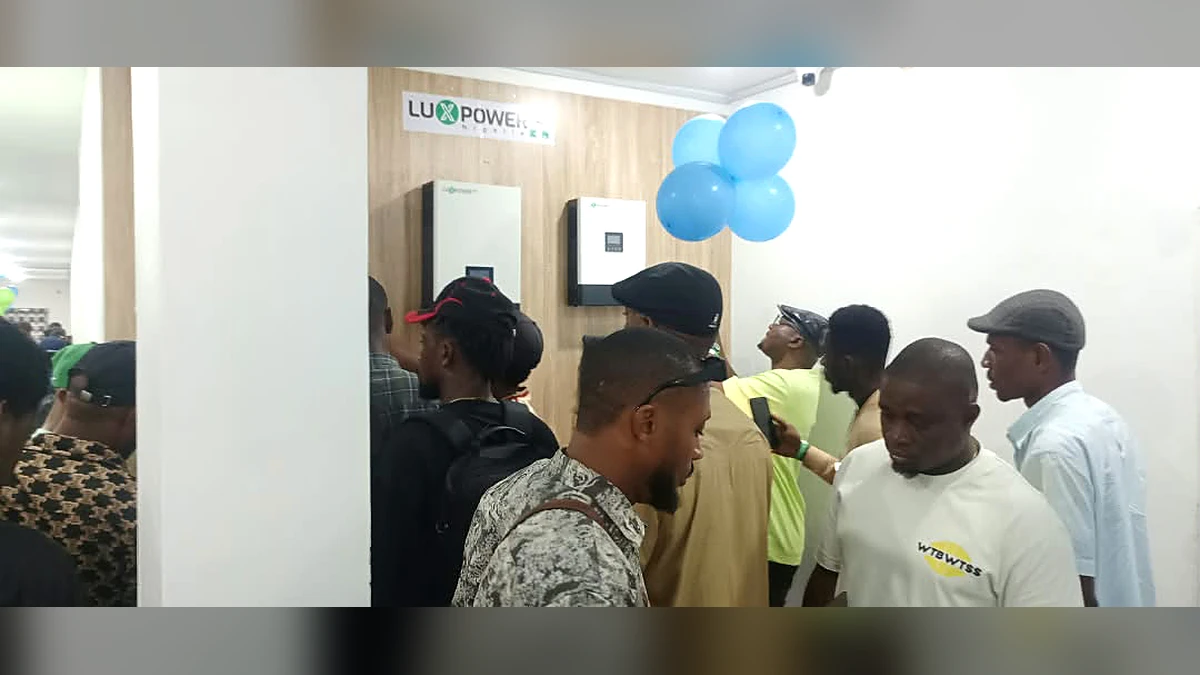 Visitors viewing LuxpowerTek energy storage equipment inside the Port Harcourt branch
